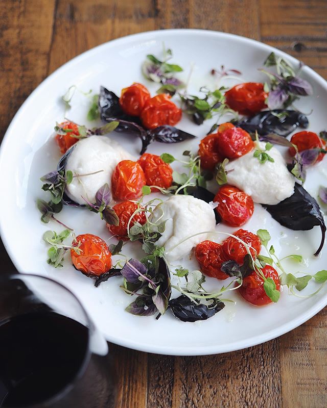 Thursdays are Local Love Night💚Tonight we have 1) Caprese with Slow Roasted Cherry Tomatoes. It has three kinds of basil, garlic oil and cashew mozz. 2) French Onion Kohlrabi Poutine. Kohlrabi fries, white pepper gravy and caramelized onions. Support our growers and eat deliciously! Also wine is half-off all night, by the bottle or glass.
.
.
.
#kohlrabi #caprese #omahagrowers #locallove  #modernloveomaha #veganchef #comfortfood #vegansofig #vegan #veganeats #veganfood #veganaf #instafood #lovefood #plantbased  #buzzfeast #eatstagram  #veganomaha #feedfeedvegan #foodstagram #omahaeats #imhorngry #horngyvegan #omahaeats #omaha #omahafoodie #midtownomaha